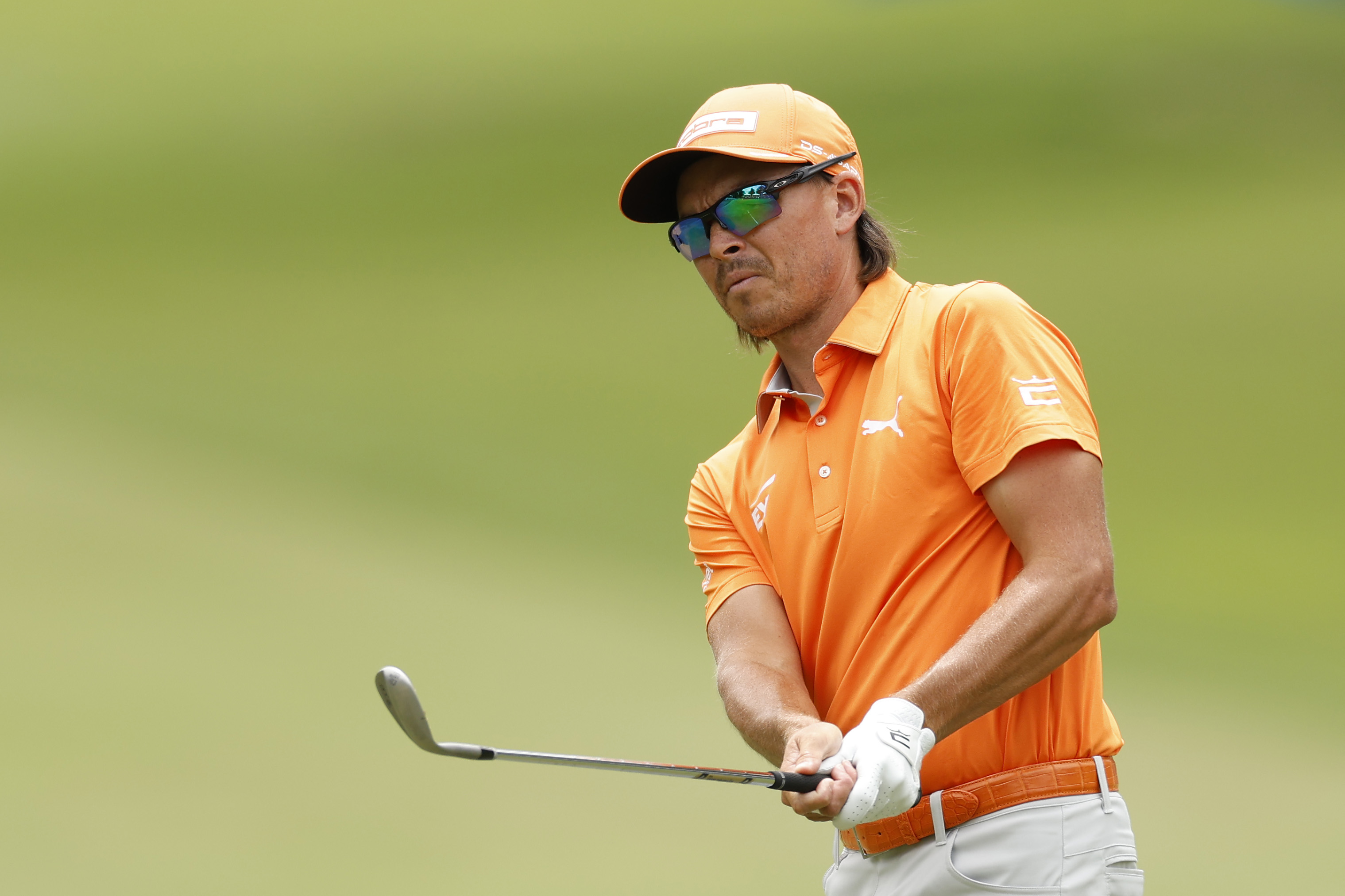 Rickie Fowler hits a chip shot