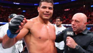 Paulo Costa is interviewed by Joe Rogan in the cage at UFC 327