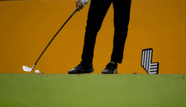 A general view of a LIV golfer's legs, club and ball as they tee off at LIV Golf South Africa