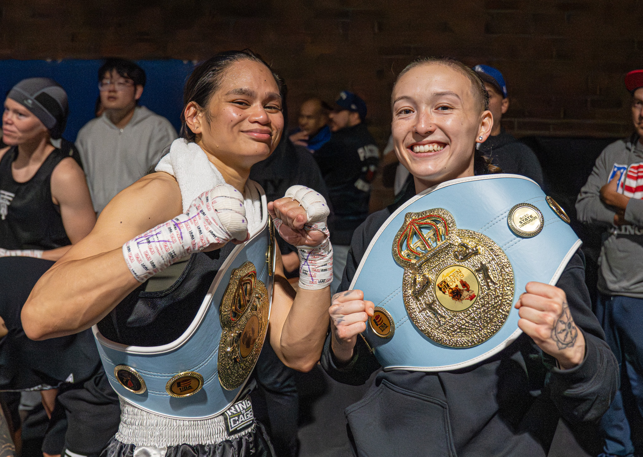 Jackie Espejo and Neely Nagaye hold their championship belts during...