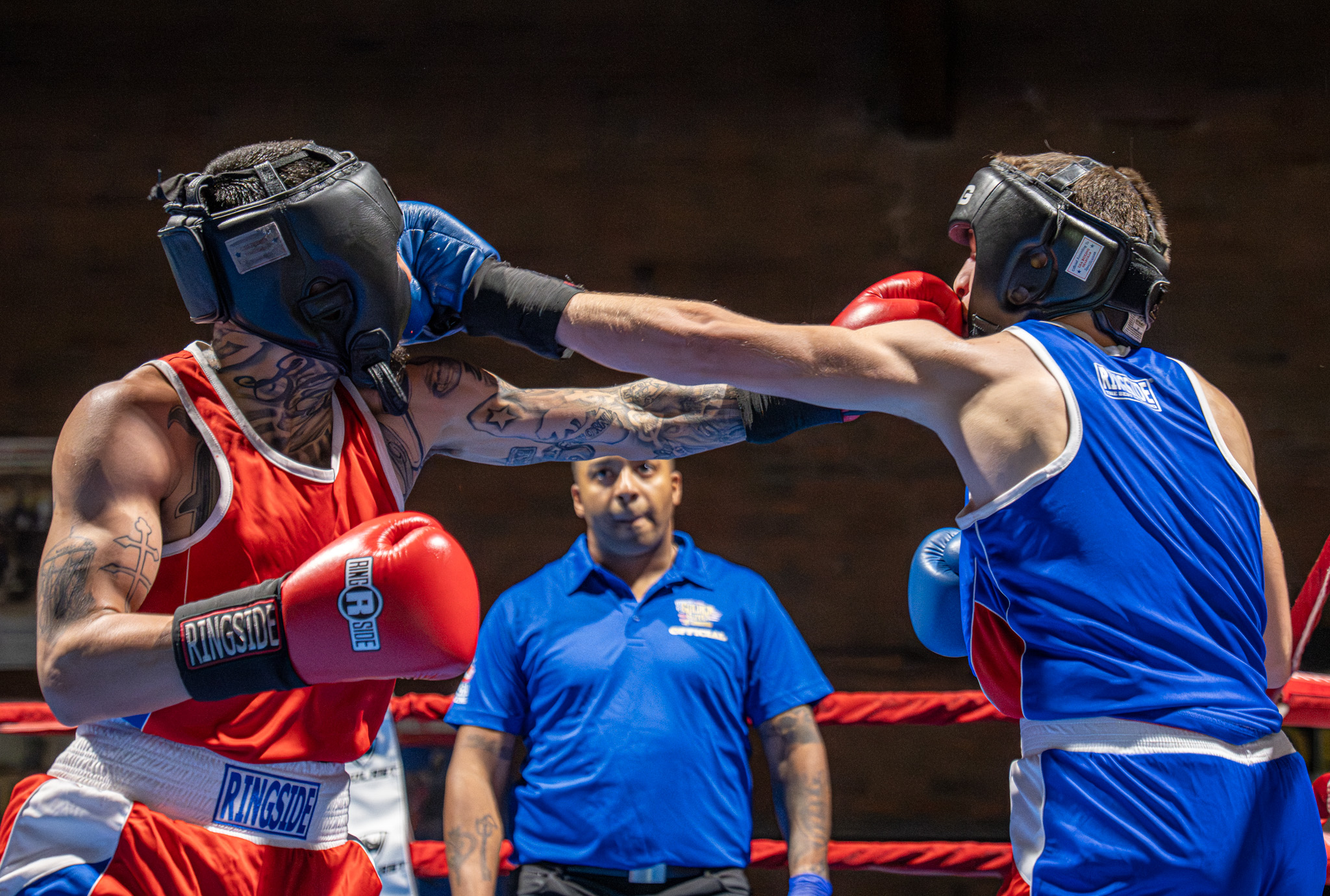 Angel Leon (Red) lands a left-handed punch against Robert Conway...