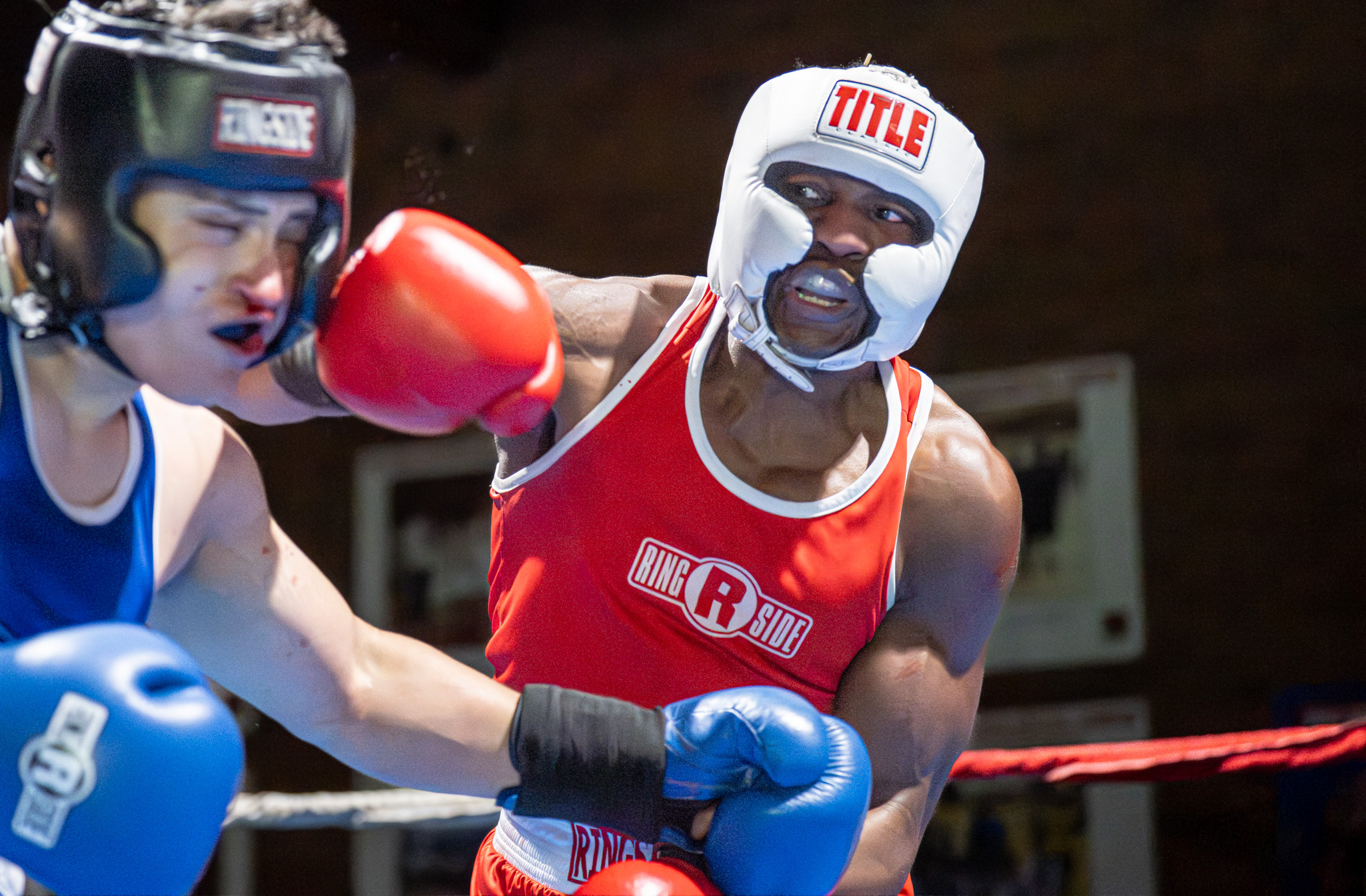 Reuben Flowers (Red) lands a right-handed punch against Omar Escobar...