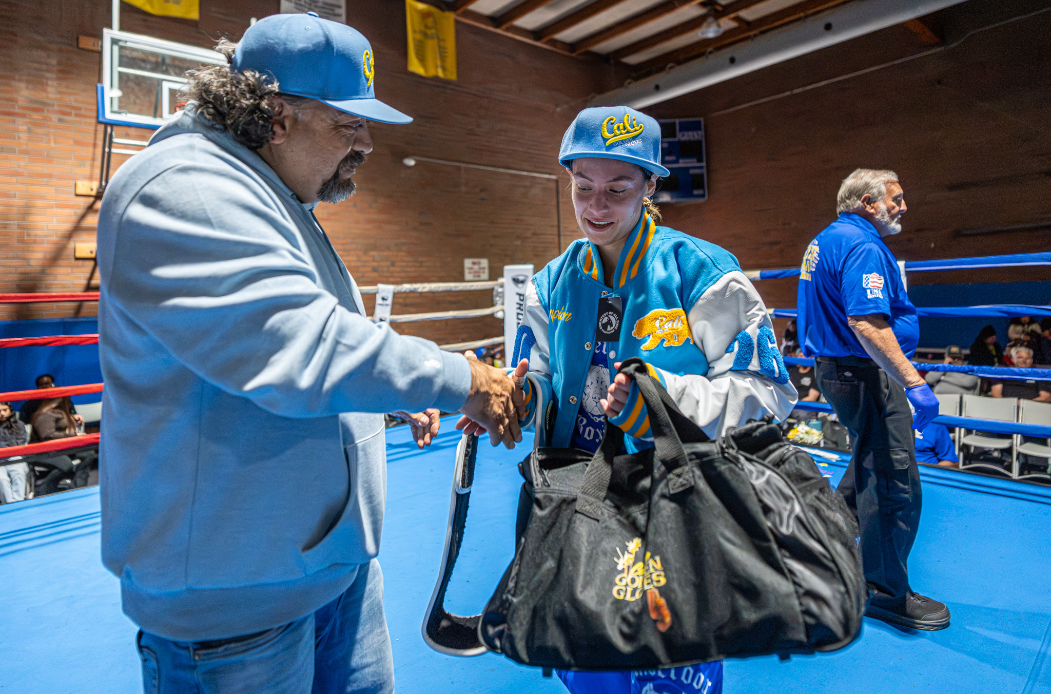 Fausto De La Torre congratulates Shavana Trejo on her victory...
