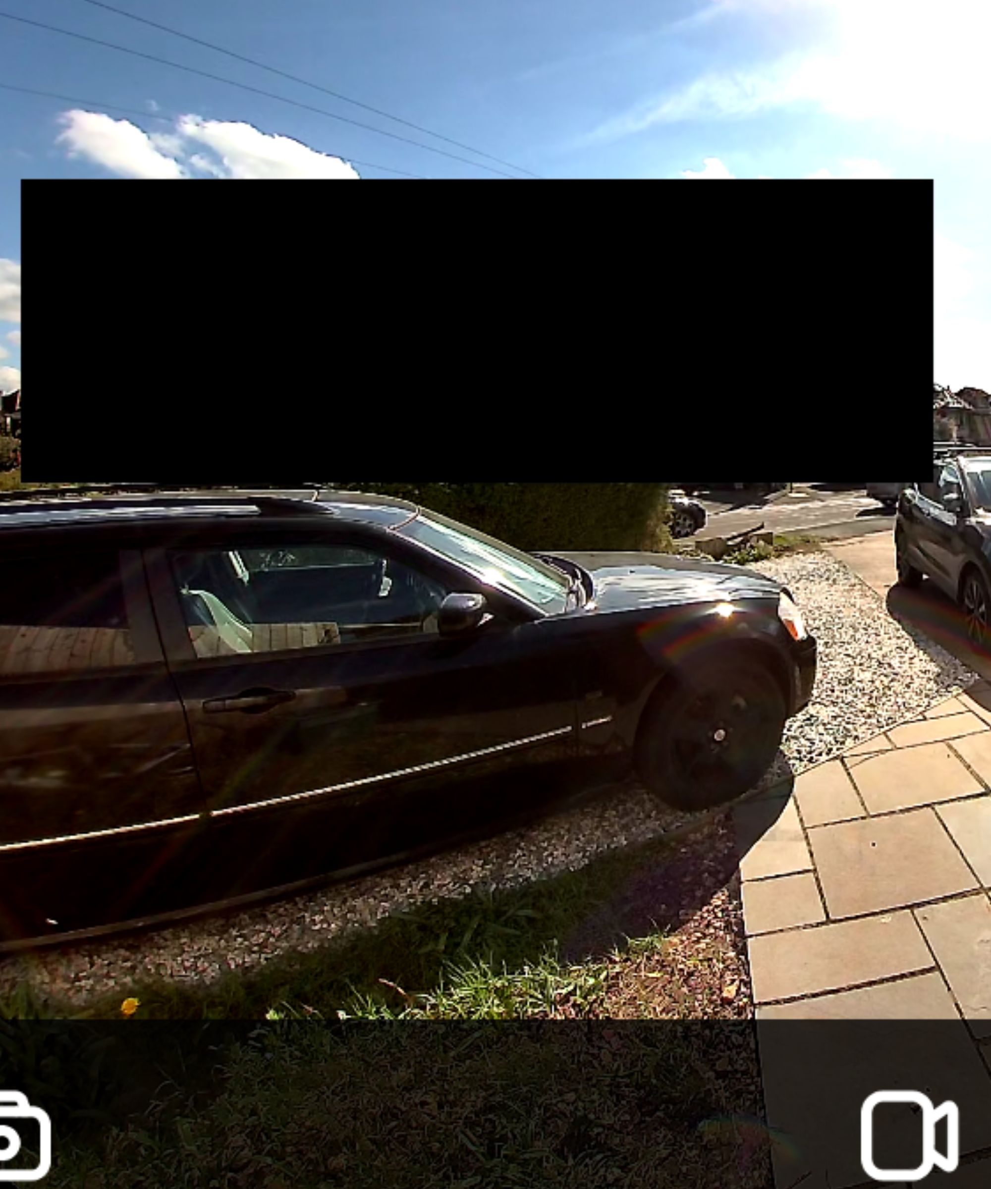 Screenshot of Reolink app showing black privacy block covering neighbor's house.