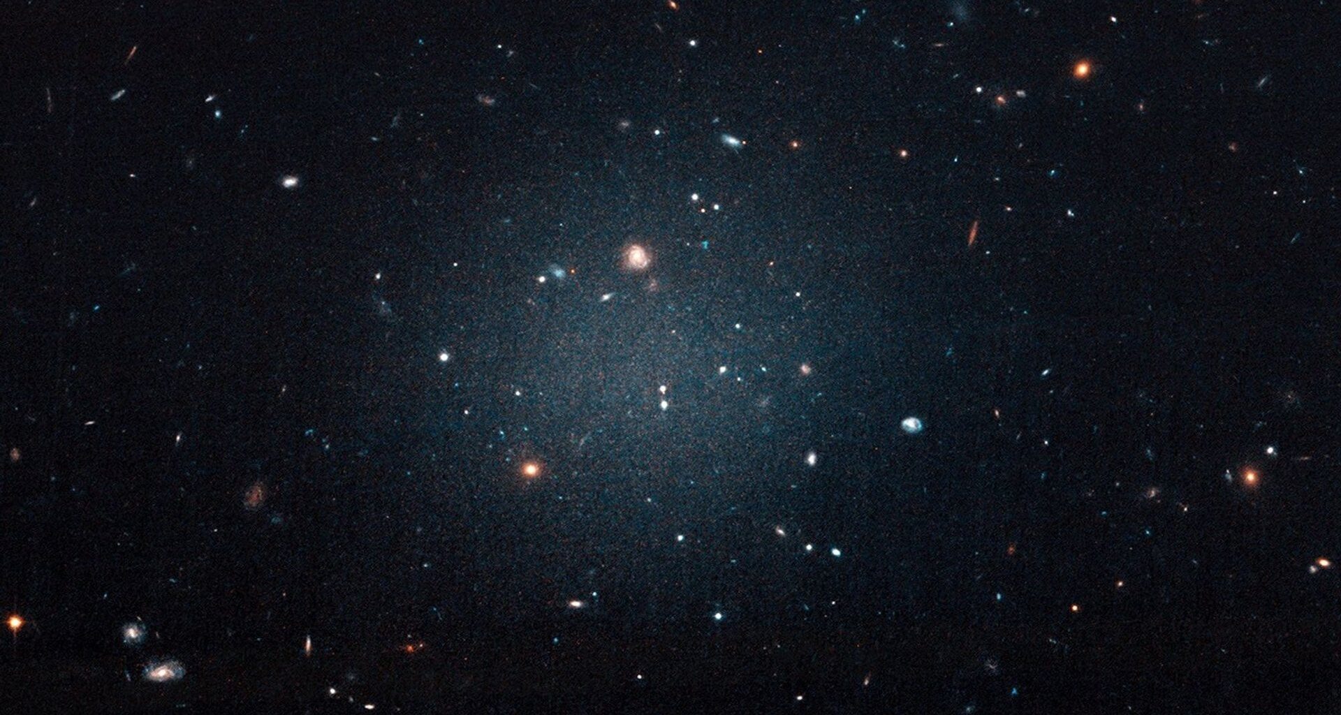 Image of the NGC 1052-DF2 Ultra Diffuse Galaxy that started the chain of discoveries of galaxies lacking dark matter. Credit - NASA, ESA, and P. van Dokkum (Yale)