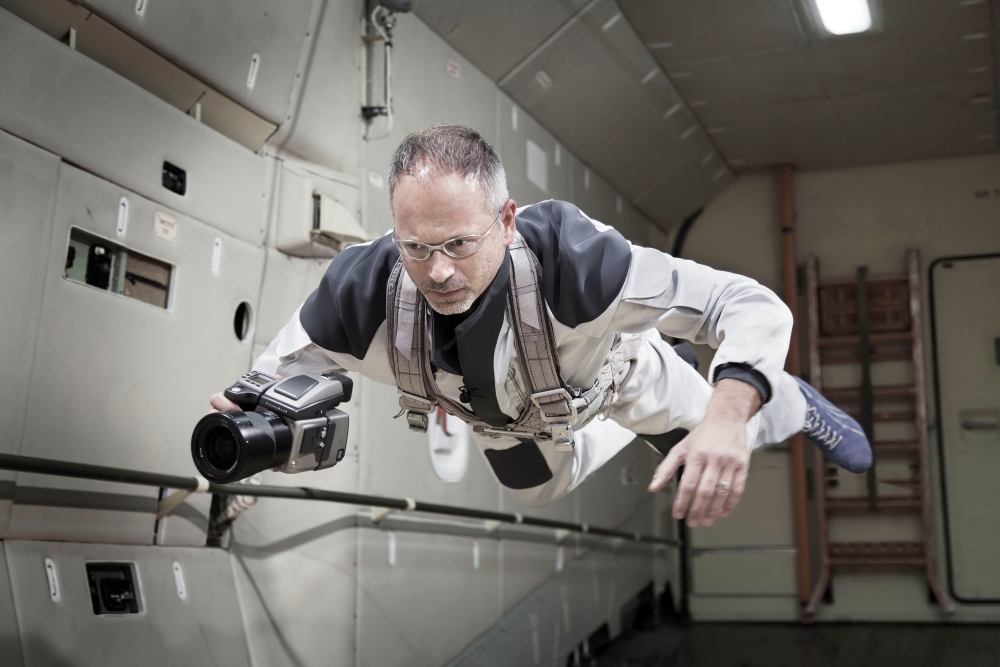 Najjar undergoes zero-gravity flight training while photographing in microgravity. (Credit: Thomas Rusch)