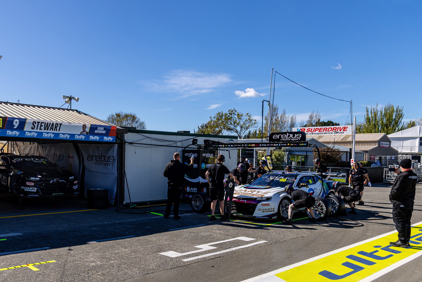An Erebus Motorsport V8 Supercar conducting pit stop practice