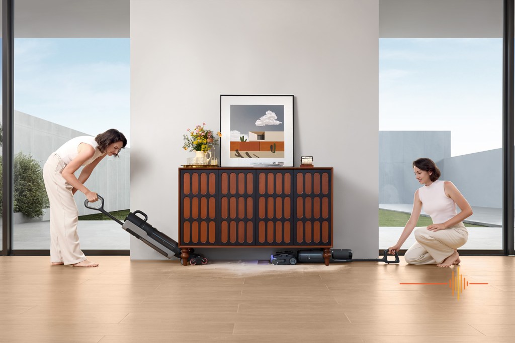 Tineco S7 Stretch used by attractive woman cleaning under cabinet