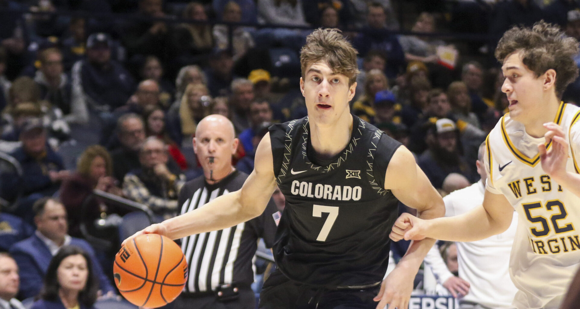 Mar 20, 2026; Philadelphia, PA, USA; Furman Paladins guard Alex Wilkins (10) dribbles the ball past UConn Huskies guard Alec Millender (9) in the second half during a first round game of the men's 2026 NCAA Tournament at Xfinity Mobile Arena. Mandatory Credit: Kyle Ross-Imagn Images