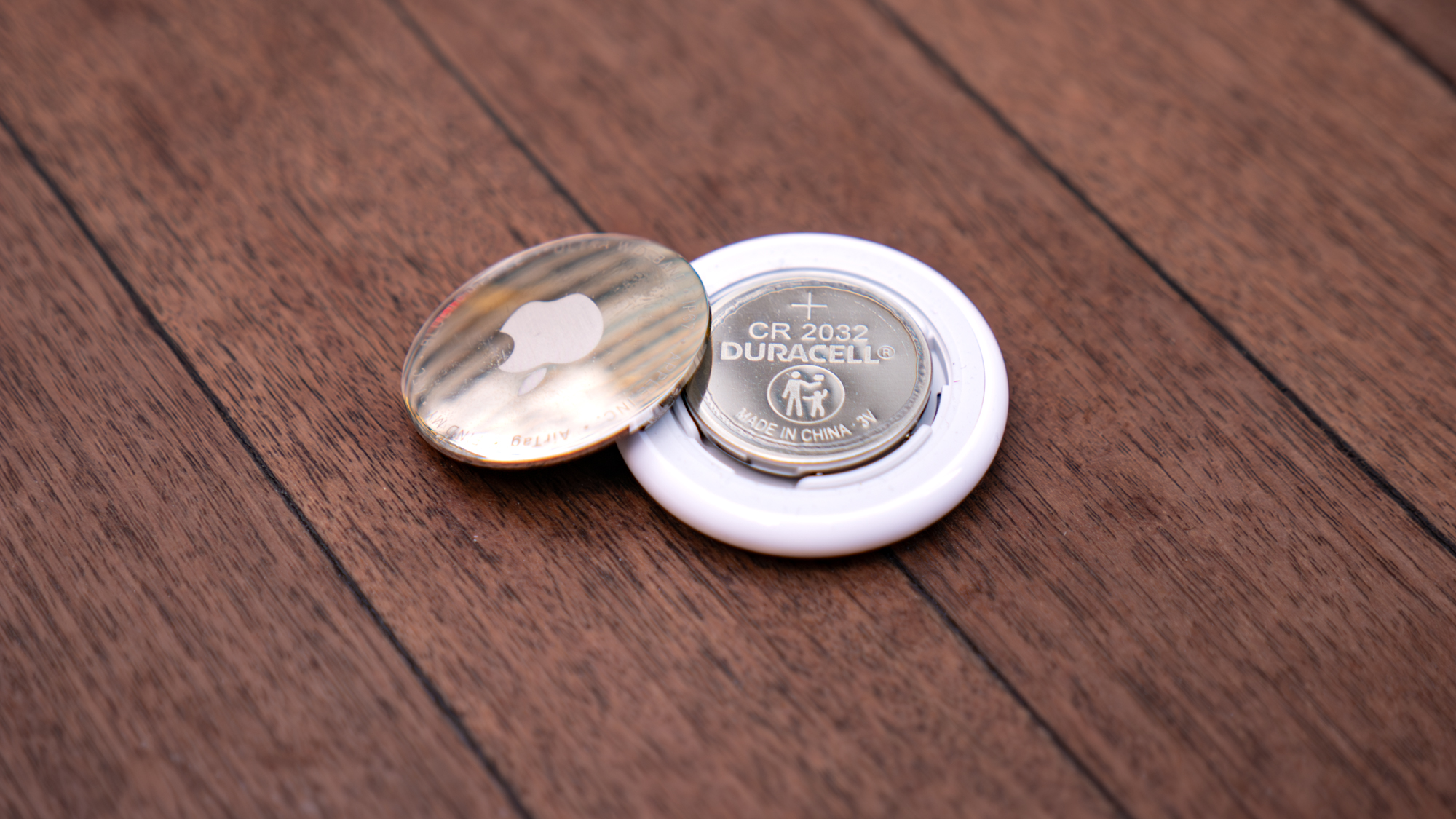 Apple AirTag 2 held in the hand.