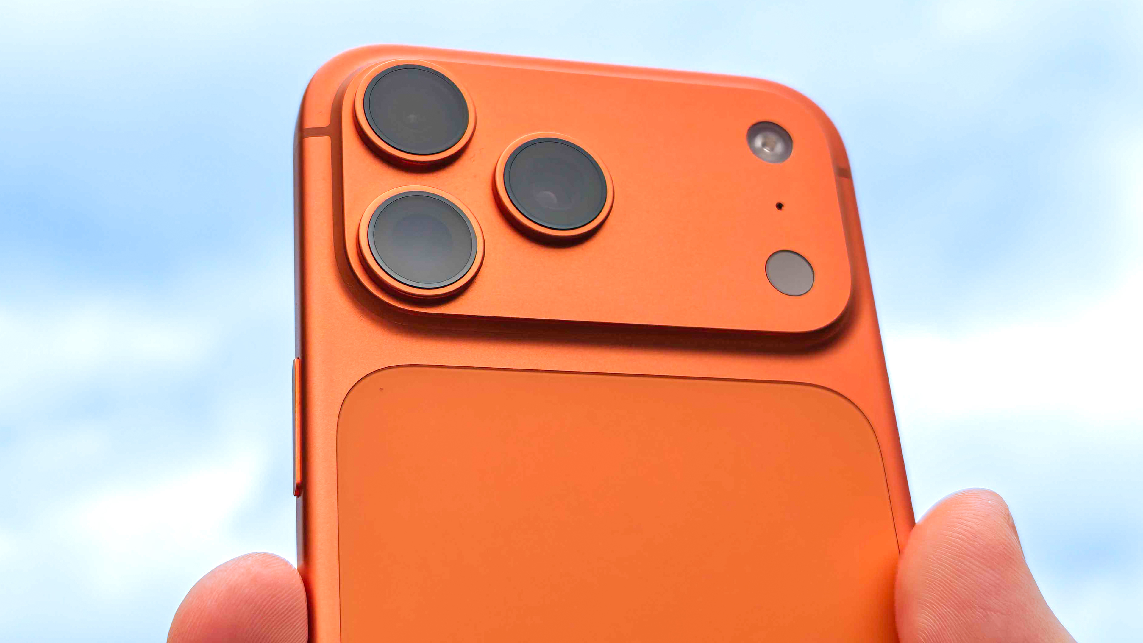 iPhone 17 Pro Max held up to sky