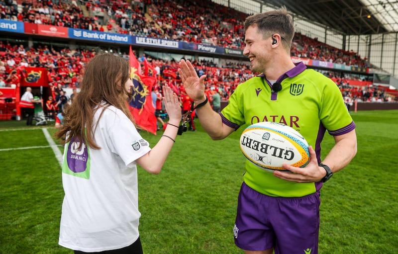 Saoirse Prenderville with referee Sam Grove-White before Saturday's URC match between Munster and Ulster at Thomond Park. Photograph: Nick Elliott/Inpho