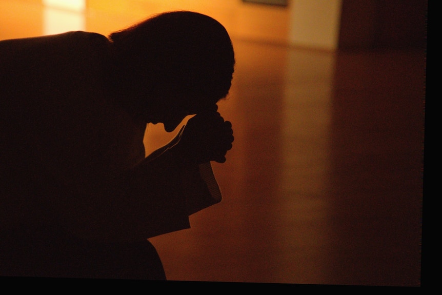 The silhouette of the side profile of a woman