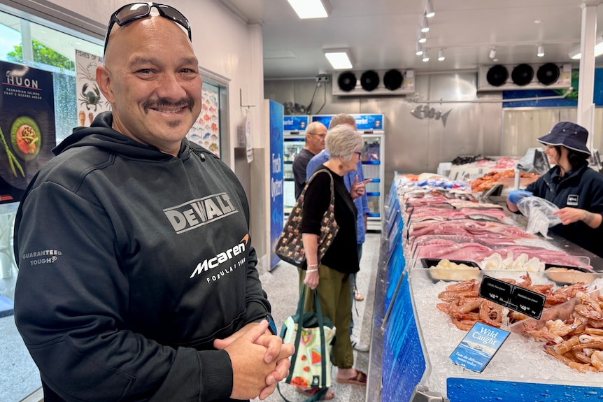 Man smiling in seafood shop