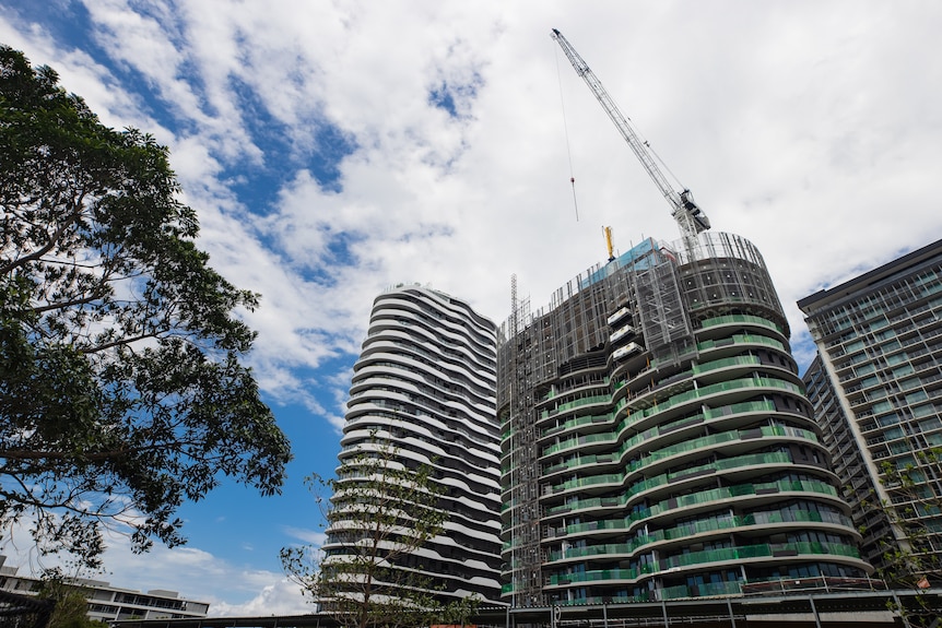 Photos of a multi-residential tower being constructed.