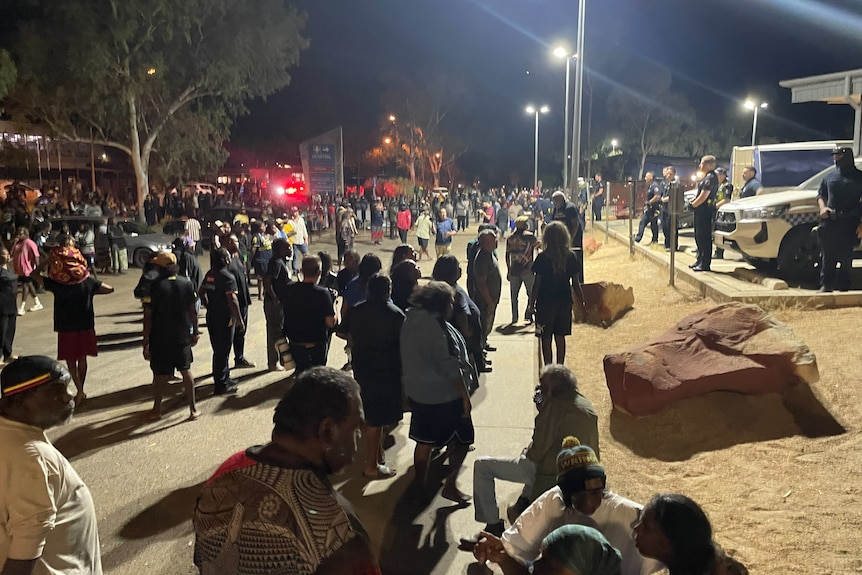 A large crowd of people on a road.