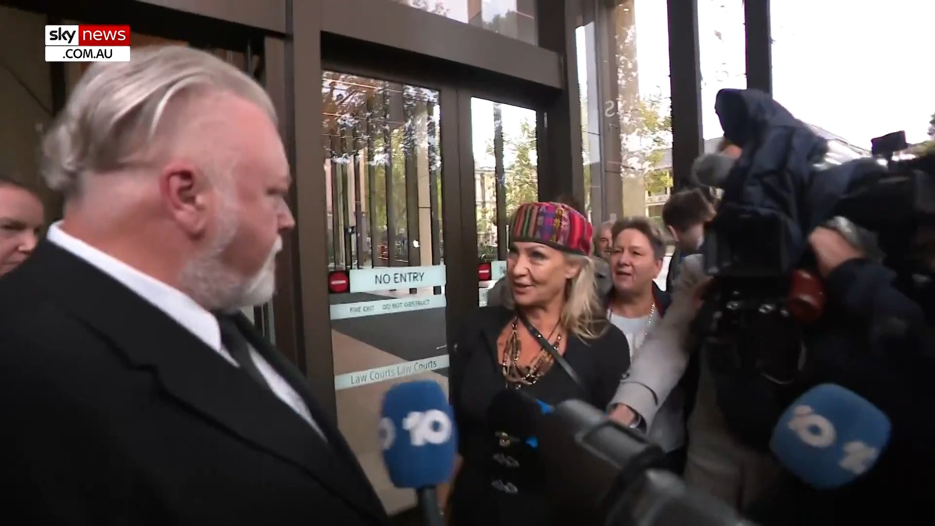 Anti-vaxxers target Kyle Sandilands outside Federal Court