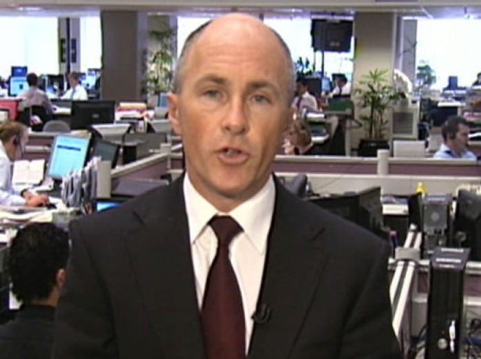 a man in a suit in a busy office