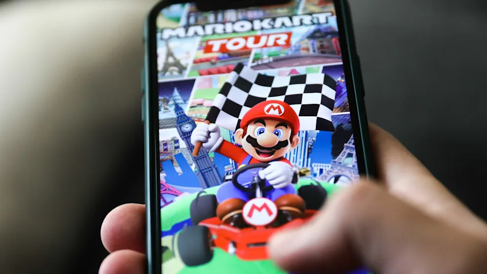 Mario Kart Tour logo on the App Store displayed on a phone screen is seen in this illustration photo.