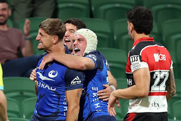 Zac Lomax celebrates scoring for the Western Force on Saturday night.