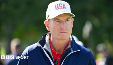 Jim Furyk wearing a white baseball cap with USA printed on the front