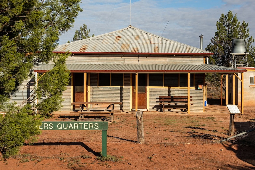Cottage with sign saying 'quarters'
