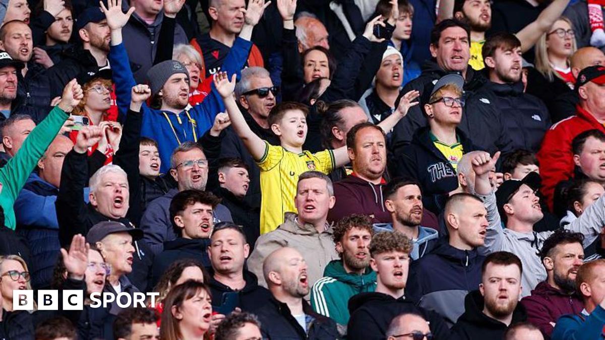 Fans sing as they watch Wrexham AFC