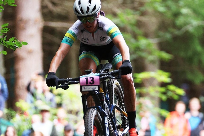 Rebecca Henderson jumps over a log