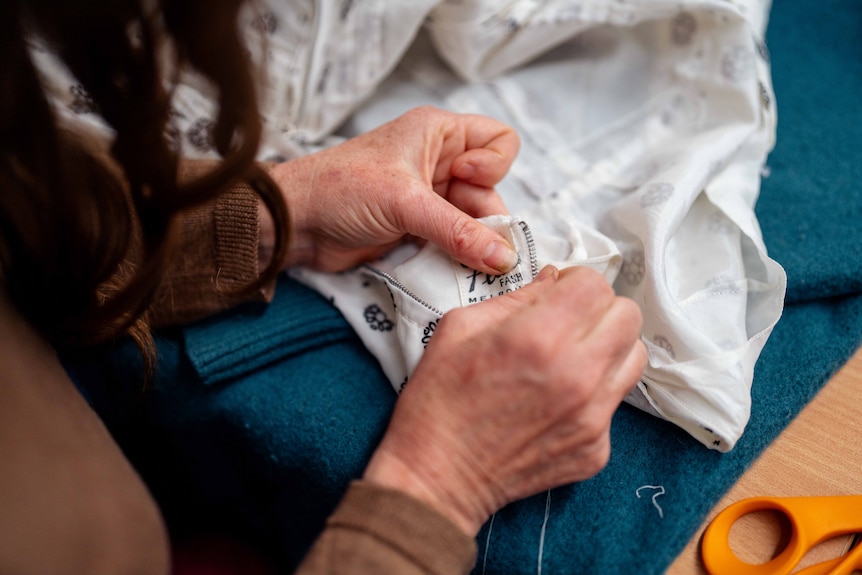 A woman hand sewing