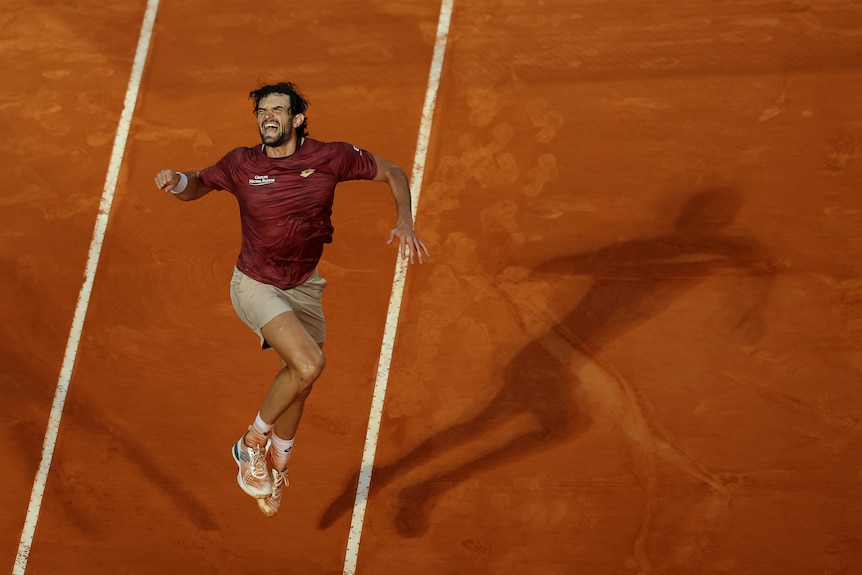 Valentin Vacherot jumps and punches the air after winning a match at the Monte Carlo Masters.