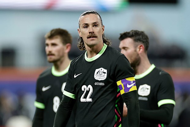 Jackson Irvine of Australia looks on.