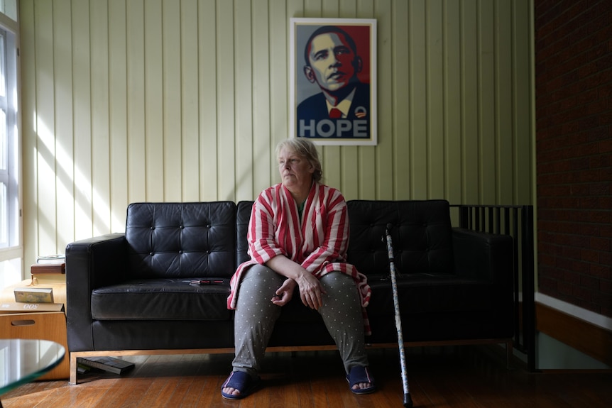 A woman sitting on a sofa.