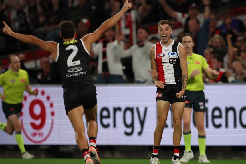 Lance Collard celebrates a goal with teammate