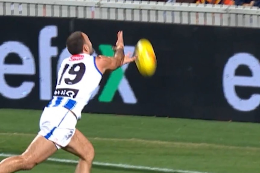 Griffin Logue touches the ball with his left hand