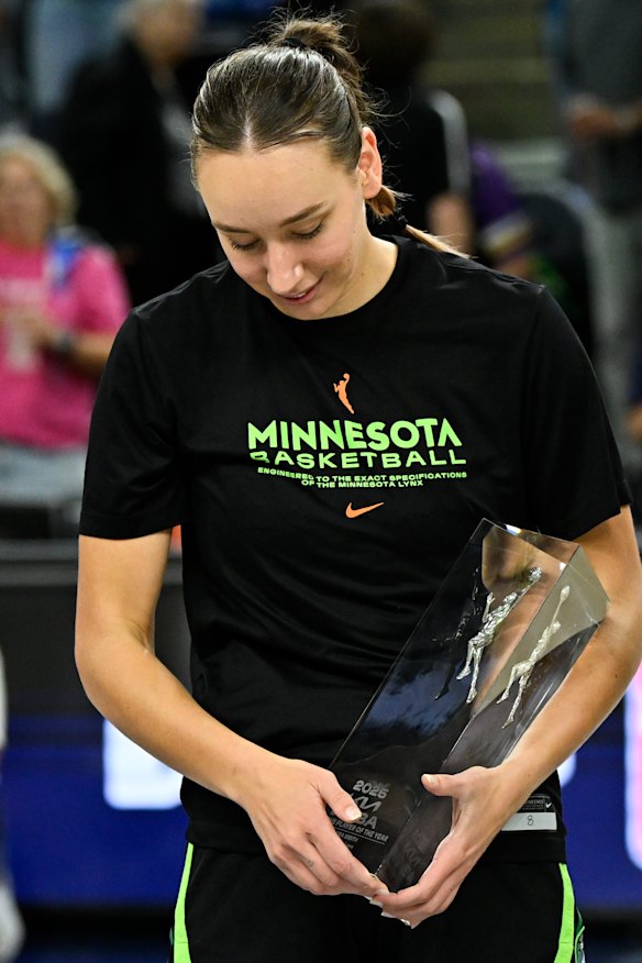 Alanna Smith receives her trophy for being co-defensive player of the year.
