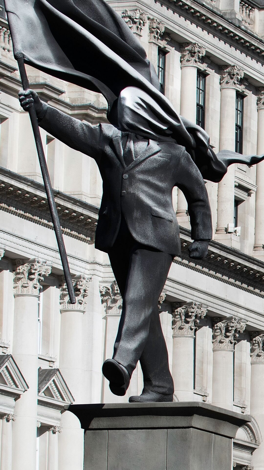 anonymous flag-bearer by banksy walks among london's historic monuments - 3