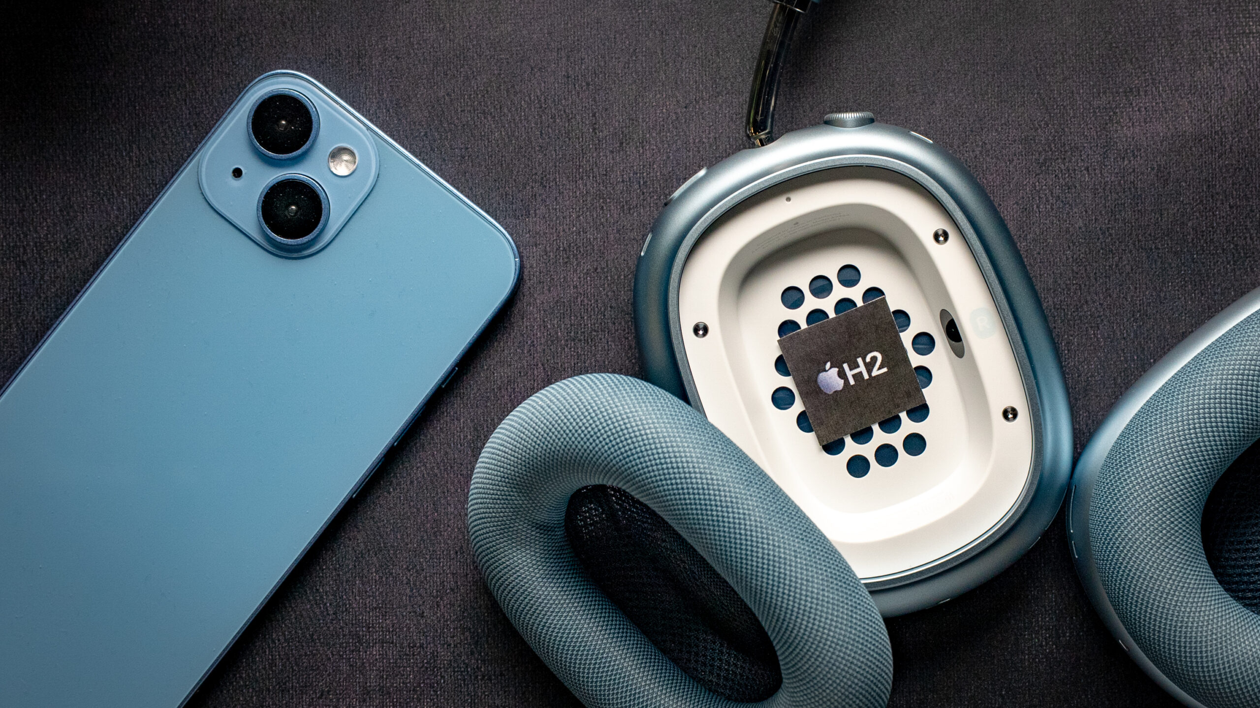 apple airpods max 2 h2 chip in ear cup A small paper cut-out of the Apple H2 chip is placed inside the ear cup of the Apple AirPods Max 2 headphones.