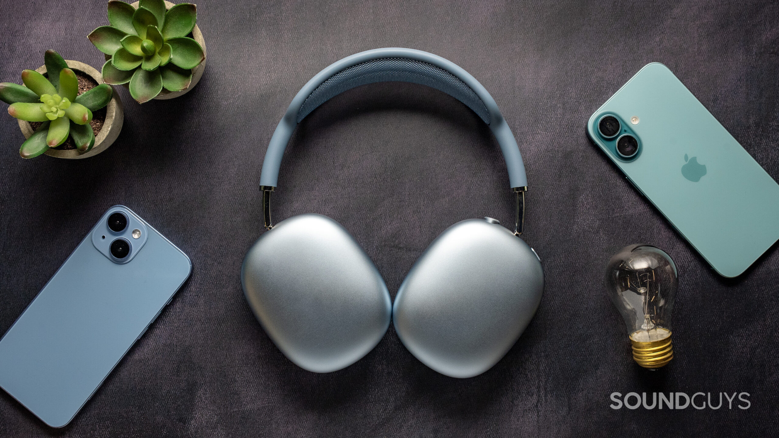 apple airpods max 2 top-down back ear cups Blue Apple AirPods Max 2 headphones face down on a table showing back ear cups.