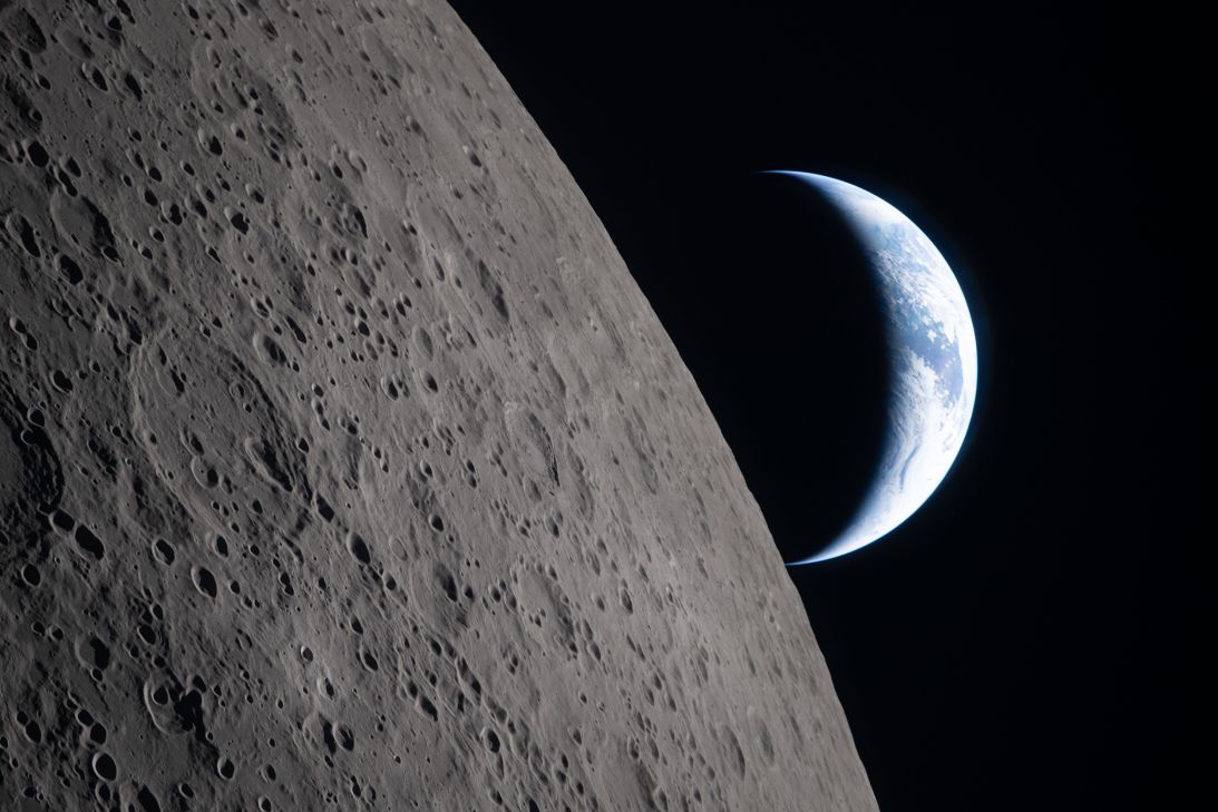 As the Artemis II astronauts came close to passing behind the moon on Monday, they captured this image of a crescent Earth with the moon in the foreground.