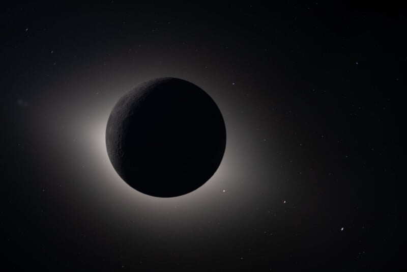 A dark planet or moon is centered against a star-filled space background, with a bright, glowing halo of light outlining its edge, creating a dramatic silhouette effect.
