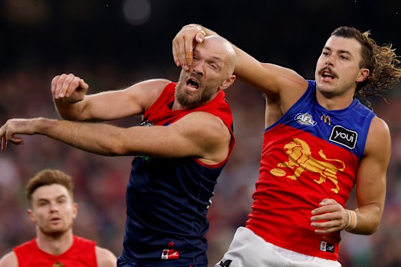 Melbourne’s Max Gawn and Lion Sam Draper compete.
