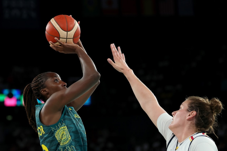 Ezi Magbegor shoots over a Belgium player in the women's basketball bronze medal game at the Paris Olympics.