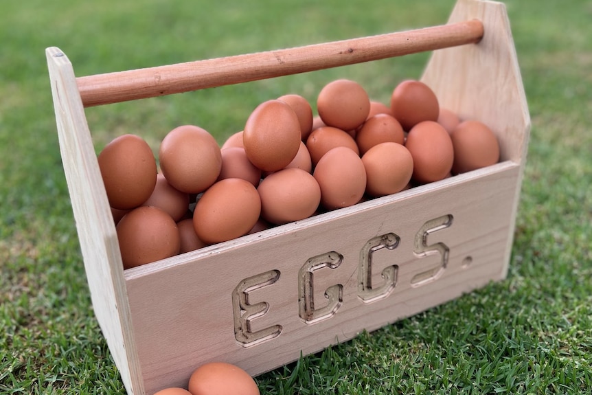 A wooden bucket of eggs.
