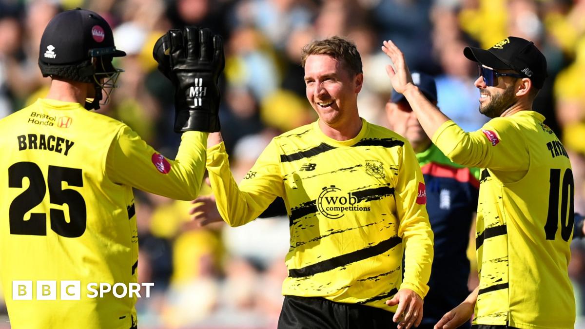 Tom Smith celebrates a wicket for Gloucestershire with team-mates