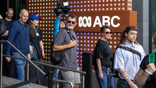 ABC staff stream out of their offices last month.