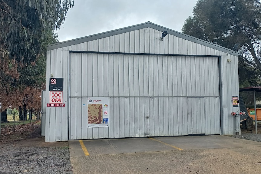 A rural firefighting shed stands in the Australian bush.