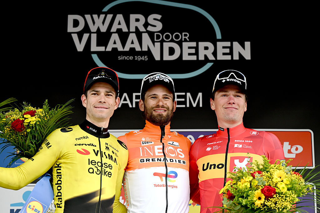 WAREGEM, BELGIUM - APRIL 01: (L-R) Wout van Aert of Belgium and Team Visma | Lease a Bike on second place, race winner Filippo Ganna of Italy and Team INEOS Grenadiers and Soren Waerenskjold of Norway and Team Uno-X Mobility on third place pose on the podium ceremony after the 80th Dwars Door Vlaanderen 2026 - Men&amp;apos;s Elite a 184.6km one day race from Roeselare to Waregem / #UCIWT / on April 01, 2026 in Waregem, Belgium. (Photo by Dario Belingheri/Getty Images)
