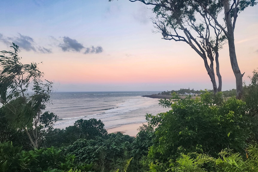 A view of a sunset over a beach.