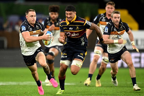 Corey Toole breaks away in the Brumbies’ win over the Highlanders.