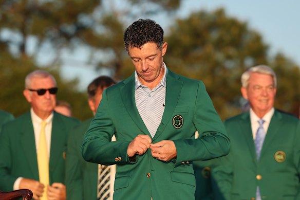 Rory McIlroy buttons up the green blazer presented to the US Masters champion – his second in two years.